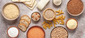 Bowls of rice quinoa corn buckwheat and other gluten-free grains